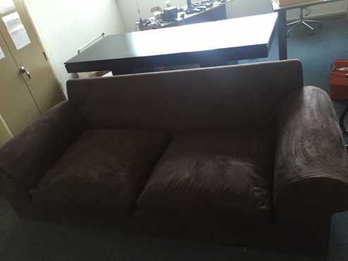 In pristine condition Large 2 seater dark brown leathery Suede Couch...