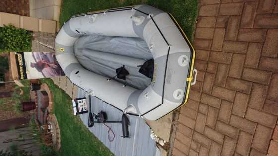 Intex Mariner 4 Inflatable Boat with 36 lb Motor and 1yr old Deep Cycle Battery for sale.