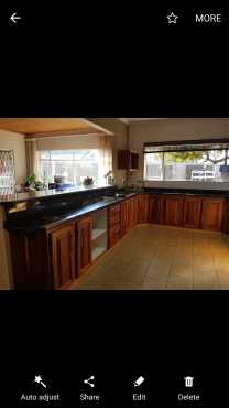 Kiaat kitchen with double oven, granite tops, oven and hob