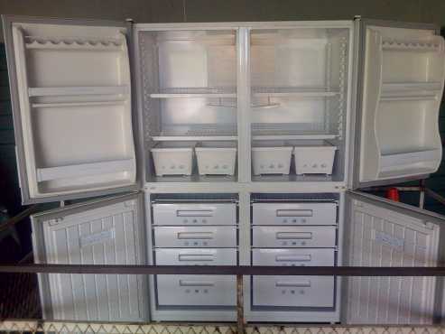 Large white FUCHSWARE 600 liter fridge freezer combination (top two doors is fridge)good condition