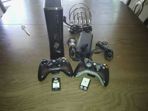 Like Brandnew Superslimeline Xbox 360 Matt Black Edition with over 70 games amp 2 wireless Controllers