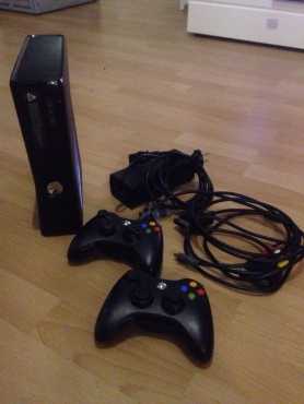 Like Brandnew Superslimeline Xbox 360 Matt Black Edition with over 70 games amp 2 wireless Controllers