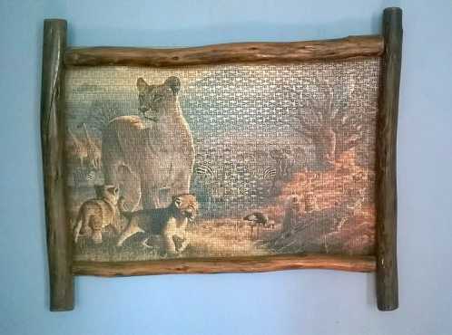 Lion puzzle in a log frame. It is a 1500 piece puzzle.  Size 930mm X 790mm.