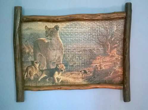 Log frame with 1500 Piece puzzle in it.