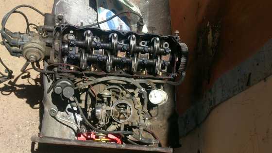 Mazda 323 B3 head cylinder, caburator,distributor and manifold for sale