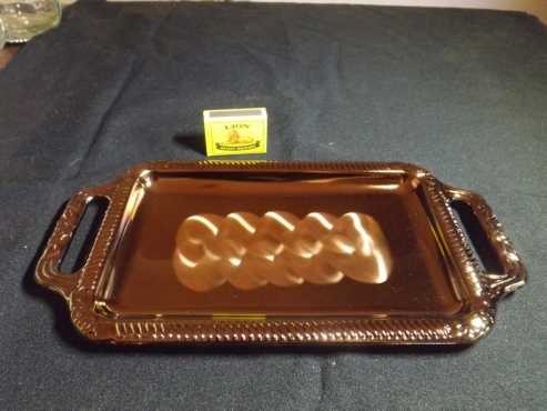 Metallic tray with pattern.