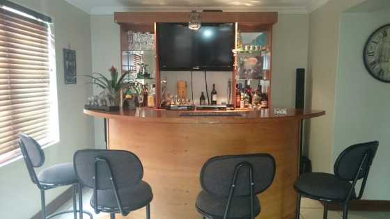 Modern wooden bar with stools