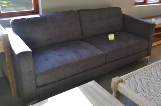 Never been used dark blue 2 seater couch. This is a fabulous and comfy couch. Retails for R8999.