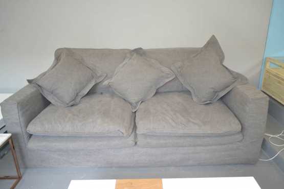 Never been used giant grey sofa. Retails for R18999. Ultra comfy