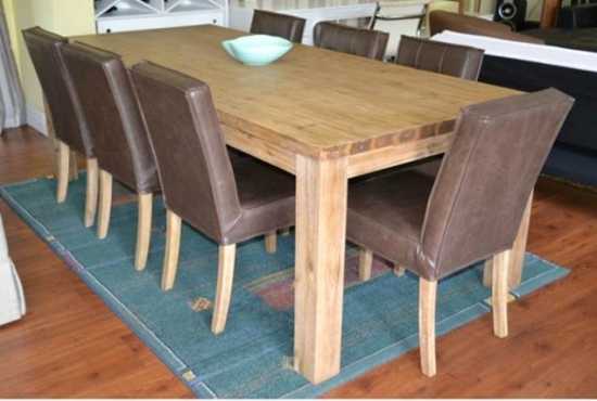 Never been used solid acacia wood dining table. Retails for R7999. Modern, trendy