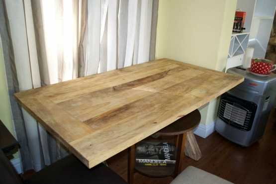 Never been used solid mango wood dining table. Retails for R6999. Contemporary, chic