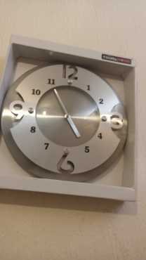 new and neat and never been used wall clock very