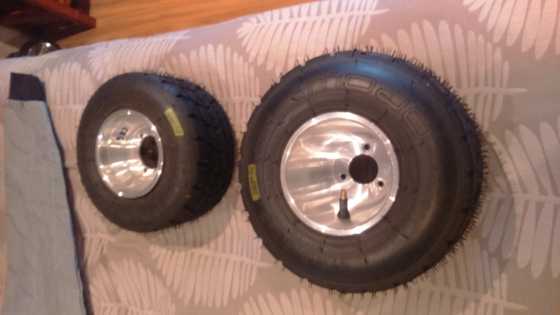 New go kart rims and wet weather mojo tires , rotax racing boots and size large suit