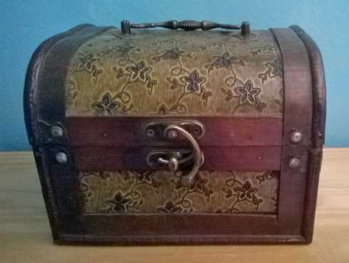 Old wooden box with brass handles.