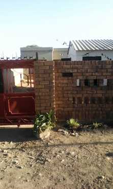 Orange Farm 2 bedrooms house with 3 outside rooms and wall around for sale