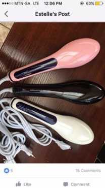 pink, white and black hair straightening brushes