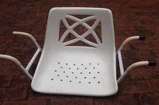 Plastic bath chair on steel frame