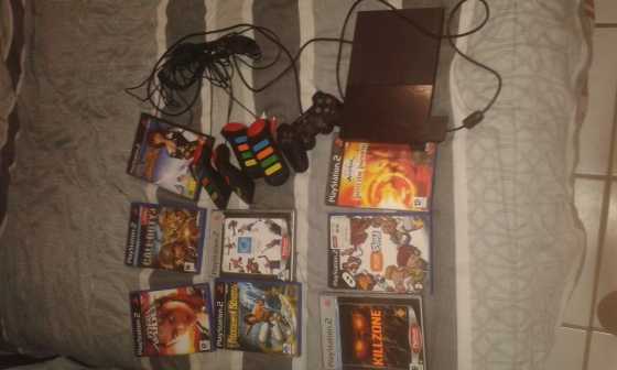 playstation 2 with controls and 11 games