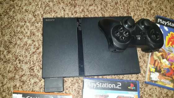 Playstation 2 with wireless remote and Games