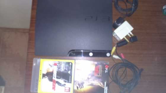 Playstation 3 with 2 Remotes and 2 Games