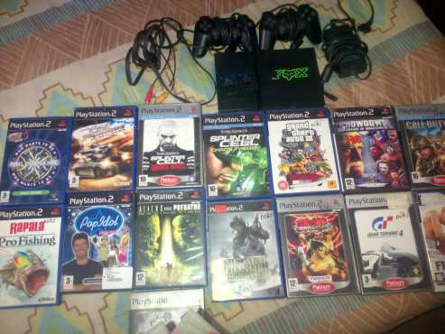 Playstation with 15 games for sale. 1x game free