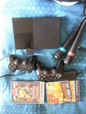 Playstation2 with 2 remotes and singstar