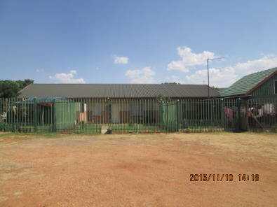 Plot with 6 dwellings 12km West of PTA