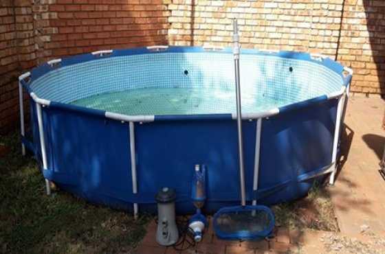 Pool for sale with all attachments, boxes and instruction books.