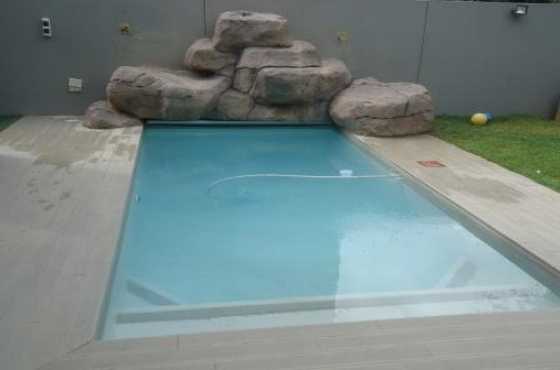 pools,rockart,pool cleaning,rock pools ,water-features,Koi ponds,paving and general construction