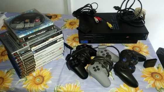 Ps 2, with wires, 2x wired remotes, 1x wireless remote, 1x 8gb memory card,and 12 games