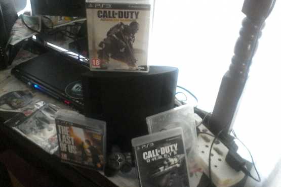 PS3 slim with 4 games