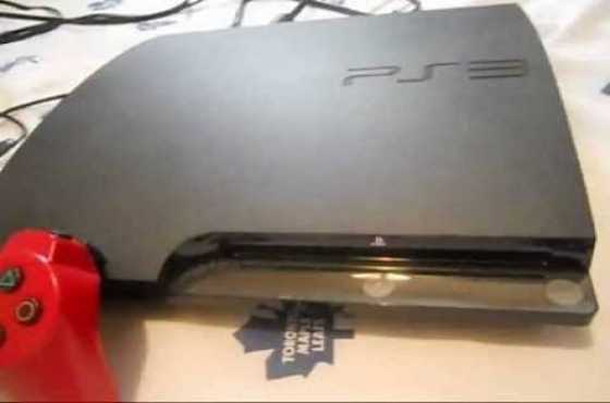 Ps3 with lots of games and steering wheel