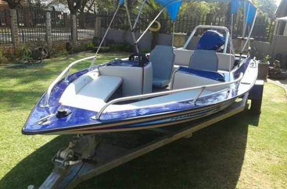 Raven Bowrider135 Evinrude with skis and a tube