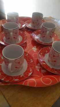 RED AND WHITE CUPS WITH SAUCERS