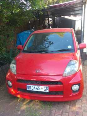 Red Daihatsu Sirion