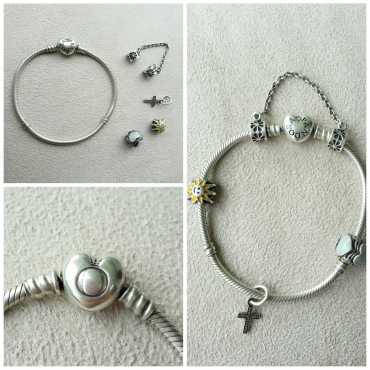 Secondhand silver Pandora bracelet for sale with charms and safety chain