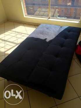 Selling a black sleeper couch in Pretoria north , still in a very good condition