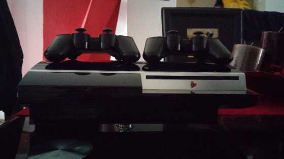 Selling a Play Station 3 with 2 remotes amp a game