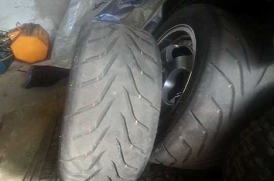 set of semi slick tyres for sale with rims.