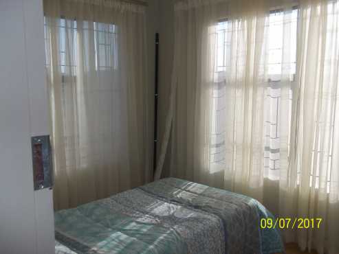 Share a en suite bedroom that has a built in wardrobe, kitchen has stove, built in units