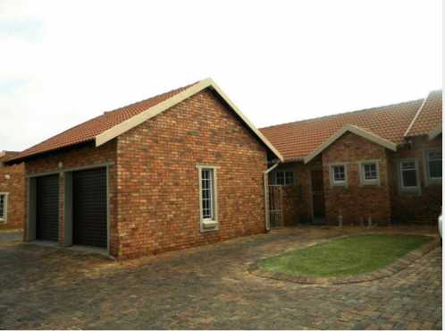 SHORT TERM Neat open plan, single story, 2 bed, 2 bath unit on the ground level with a garden