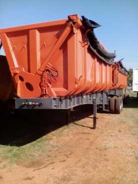 Side tipper top trailer link