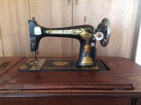 Singer Lotus pedal sewing machine oak cabinet seven drawer 1934