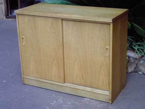 Small Oak Finish Cabinet with Sliding Doors