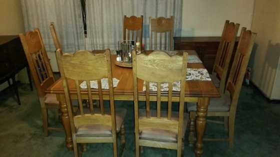 Solid oak table with eight chairs