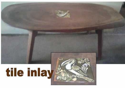 Solid wood coffee table with a bird inlay tile