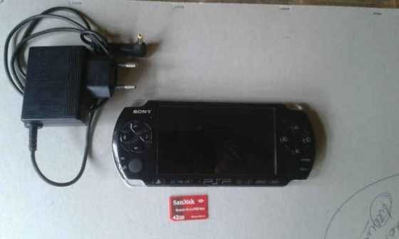 Sony psp 3004 with original charger, 2 gig pro duo memory card, 1 game