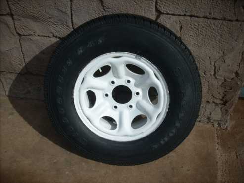 Spare wheel for a Nissan Hardbody bakkie white 15quot 6 hole for sale.