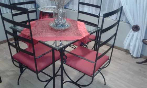 Steel and glass diningroom or pattio set.