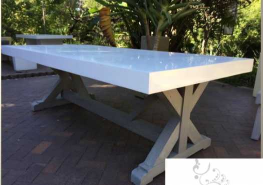 Stunning 8 seater white concrete table, with gray washed wooden legs and matching wooden bench